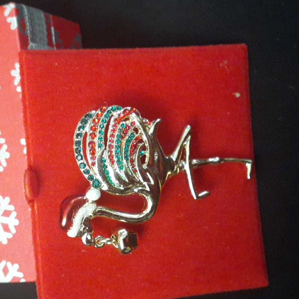 New Flamingo broch with Santa hat and bell in beak